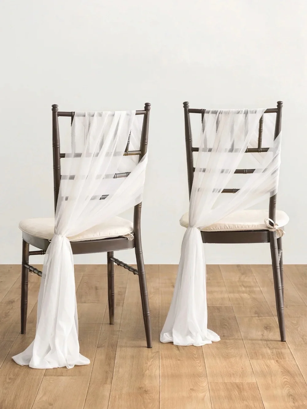 Ling’s Moment sheer white chair drapes